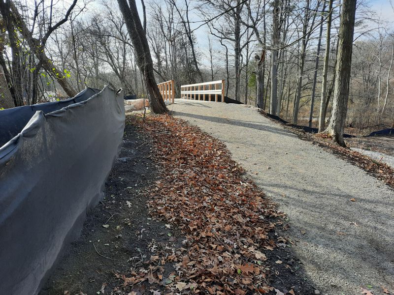 Trail up to 2023 bridge at stormwater spillway
